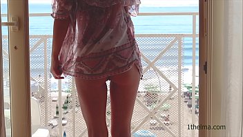Horny exhibionist  show her naked  at the window.   Public flash